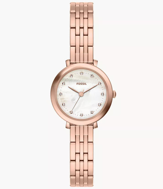 Fossil women's watch with a rose gold metal link bracelet, round rose gold case, and a white dial with black hour markers, shown against a plain off-white background.