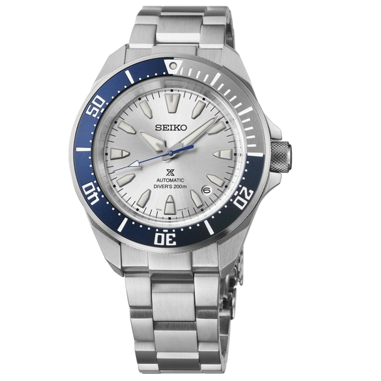 A Seiko stainless steel wristwatch with a silver-toned metal bracelet, a white dial, and a blue rotating bezel, shown against a plain white background.