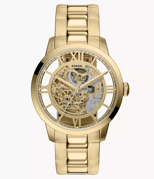 Gold watch with transparent face on a white background