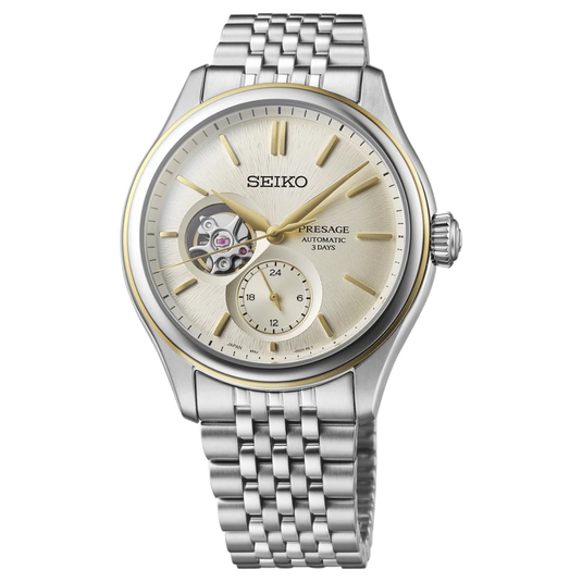 A Seiko Presage Automatic 30m wristwatch with a silver stainless steel case and link bracelet, featuring a champagne dial with gold-tone accents and a skeletonized window showing the inner movement.