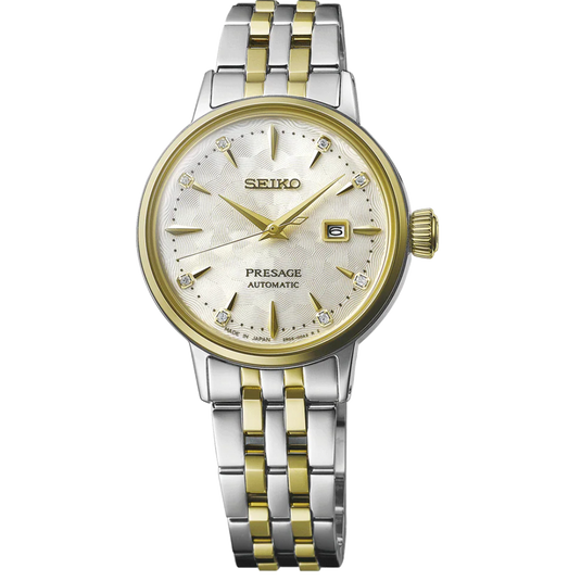 A Seiko Presage Automatic watch with a two-tone silver and gold metal bracelet, a gold-tone case, and a white dial with crystal hour markers.