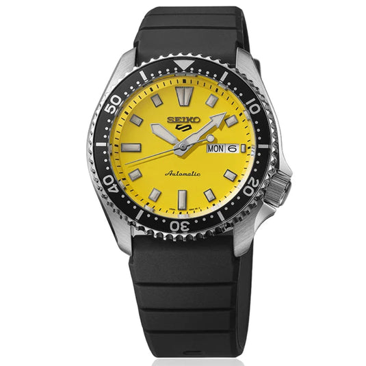 A Seiko automatic watch with a bright yellow dial, silver-tone stainless steel case, and a black rubber strap, shown against a plain white background.