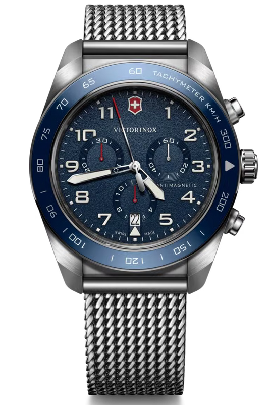 Victorinox stainless steel chronograph watch with a blue dial, blue tachymeter bezel, and silver mesh strap